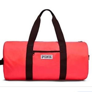 Victoria’s Secret neon orange duffel bag
